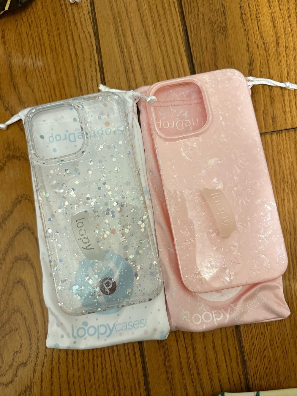 Loopy cases — clear confetti and pink marble iPhone 16 pro max